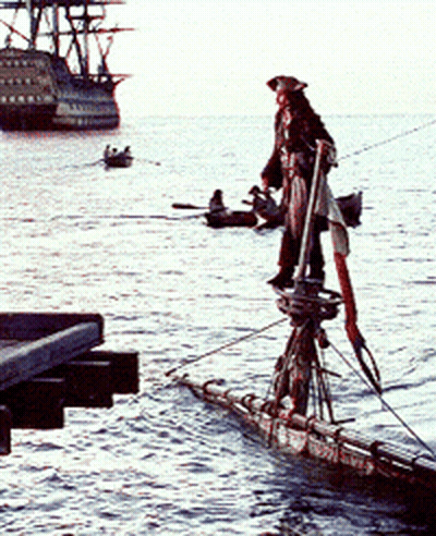 A Man In A Pirate Outfit Is Standing On A Boat In The Water GIF