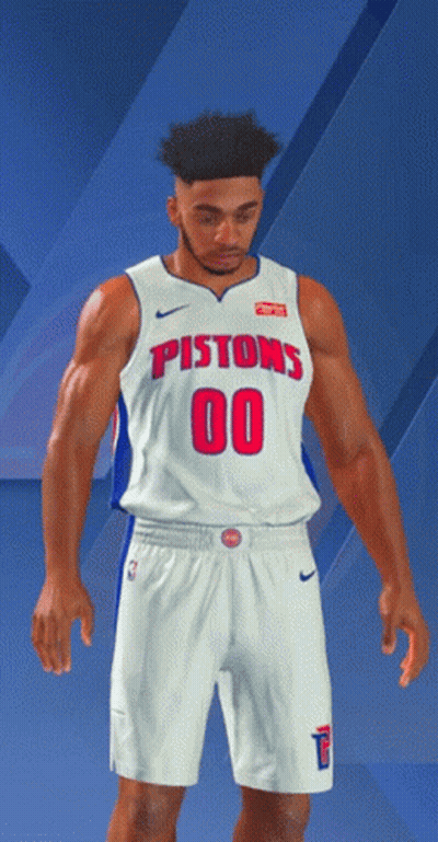 A Man In A Pistons Jersey And Shorts Stands In Front Of A Blue Background GIF