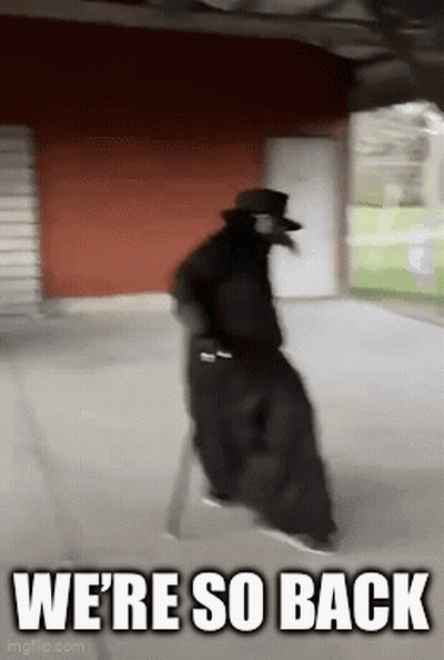 A Man In A Plague Doctor Costume Is Walking Down A Sidewalk With The Words `` We 'Re So Back '' . GIF