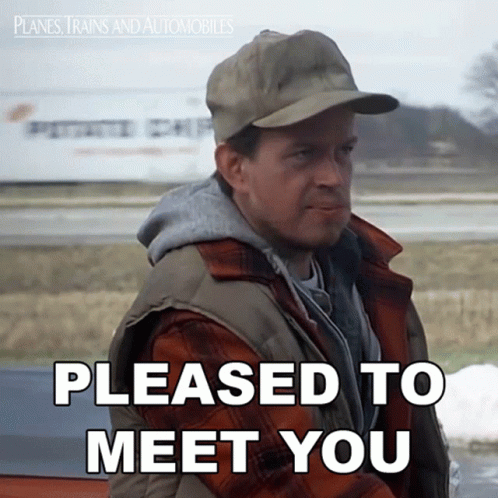 A Man In A Plaid Shirt And Hat Says " Pleased To Meet You " GIF
