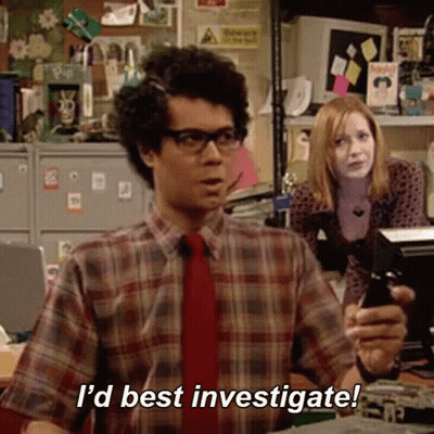 A Man In A Plaid Shirt And Tie Is Holding A Cell Phone And Saying `` I 'D Best Investigate ! '' GIF