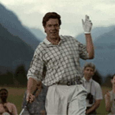 A Man In A Plaid Shirt And White Pants Is Holding A Golf Club And Waving . GIF