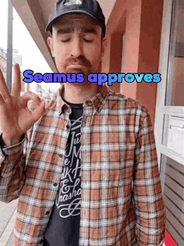 A Man In A Plaid Shirt Giving An Ok Sign With The Words Seamus Approves Written Above Him GIF