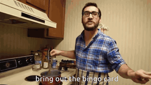 A Man In A Plaid Shirt Is Cooking In A Kitchen With The Words Bring Out The Bingo Card Below Him GIF