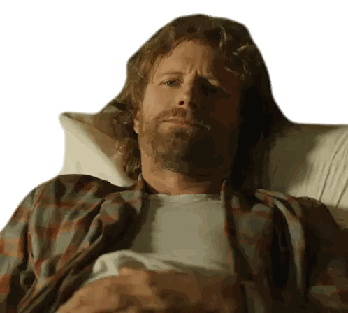 A Man In A Plaid Shirt Is Laying In A Bed Sticker