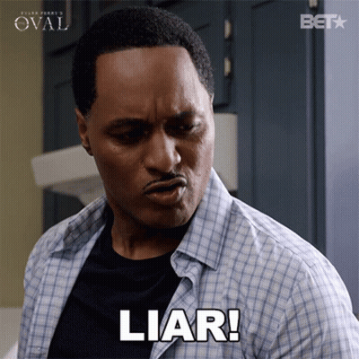 A Man In A Plaid Shirt Is Making A Face And Saying Liar GIF