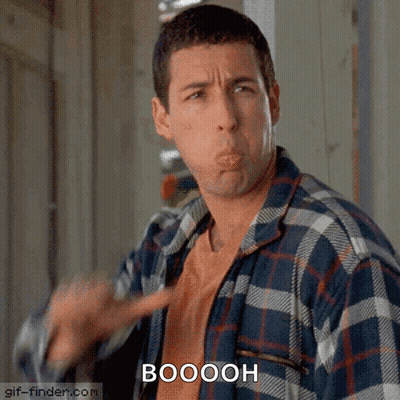 A Man In A Plaid Shirt Is Making A Funny Face And The Word Booooh Is Above Him GIF