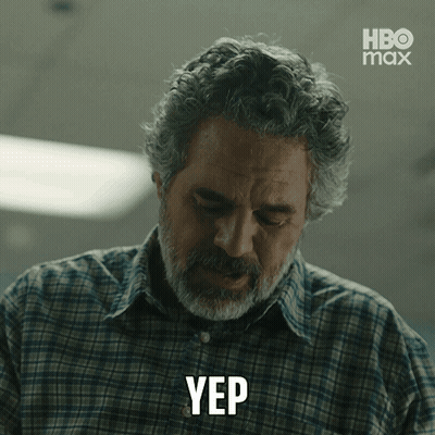 A Man In A Plaid Shirt Is Making A Yep Gesture GIF