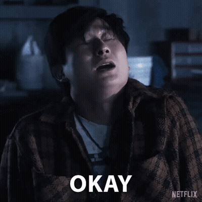 A Man In A Plaid Shirt Is Saying Okay With His Eyes Closed GIF