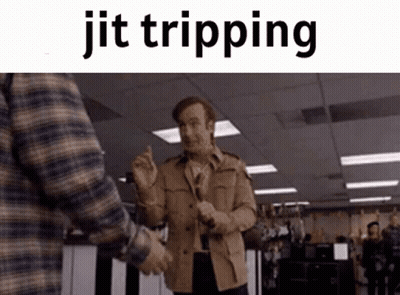 A Man In A Plaid Shirt Is Shaking Hands With Another Man . GIF
