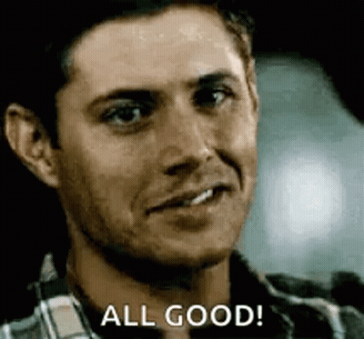 A Man In A Plaid Shirt Is Smiling And Saying All Good . GIF