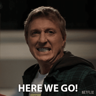 A Man In A Plaid Shirt Is Smiling And Says Here We Go Netflix GIF