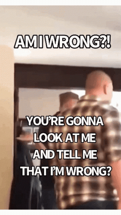 A Man In A Plaid Shirt Is Standing In Front Of A Group Of People And Says Ami Wrong ! GIF