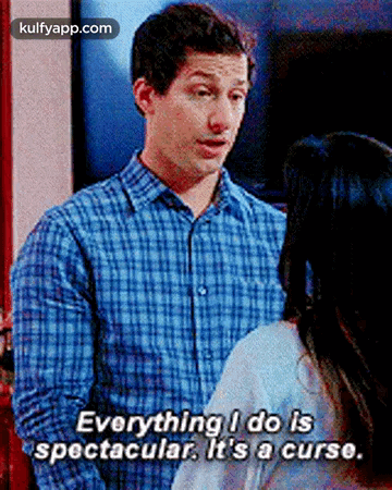 A Man In A Plaid Shirt Is Talking To A Woman And Saying Everything I Do Is Spectacular It 'S A Curse GIF