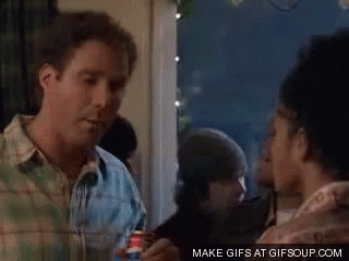 A Man In A Plaid Shirt Is Talking To A Woman In A Crowd . GIF