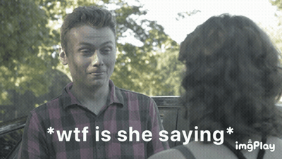 A Man In A Plaid Shirt Is Talking To A Woman Who Is Saying " Wtf Is She Saying * " GIF