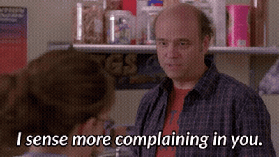 A Man In A Plaid Shirt Is Talking To A Woman Who Says I Sense More Complaining In You GIF