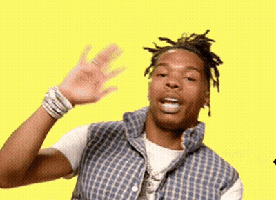 A Man In A Plaid Shirt Is Waving His Hand In Front Of A Yellow Background . GIF