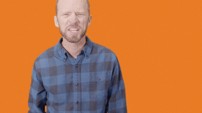 A Man In A Plaid Shirt Points At The Camera With The Words Let 'S Go GIF