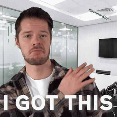 A Man In A Plaid Shirt Says " I Got This " In Front Of A Conference Room GIF