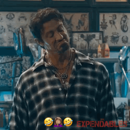 A Man In A Plaid Shirt Says I 'M Good In A Tattoo Shop GIF