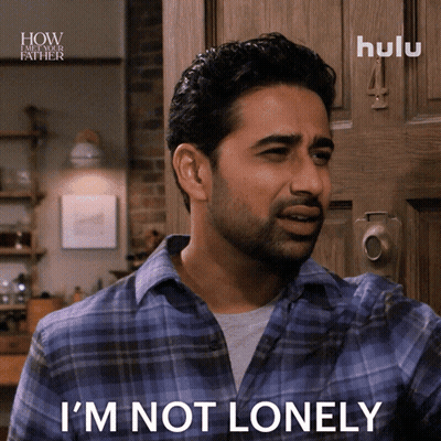 A Man In A Plaid Shirt Says I 'M Not Lonely In Front Of A Door GIF