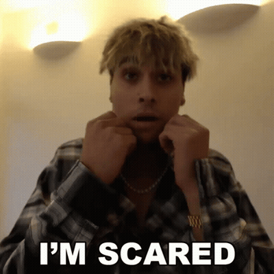 A Man In A Plaid Shirt Says I 'M Scared With His Hands On His Face GIF