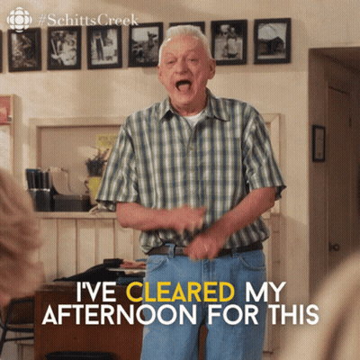 A Man In A Plaid Shirt Says " I 'Ve Cleared My Afternoon For This " In A Room GIF