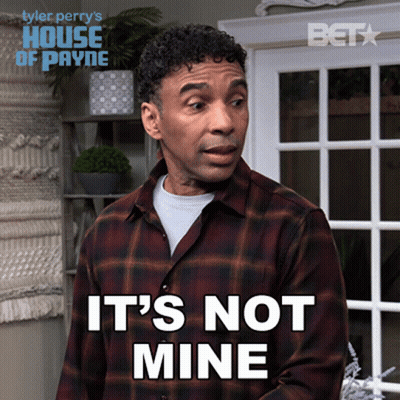 A Man In A Plaid Shirt Says It 'S Not Mine In Front Of A Window GIF