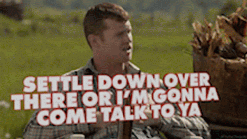 A Man In A Plaid Shirt Says Settle Down Over There Or I 'M Gonna Come Talk To Ya .. GIF