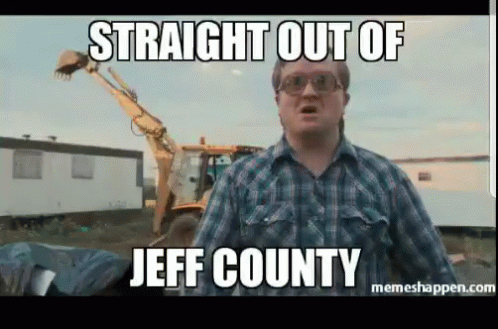A Man In A Plaid Shirt Stands In Front Of A Bulldozer With The Caption Straight Out Of Jeff County GIF