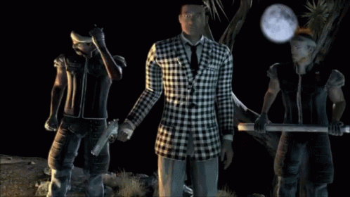 A Man In A Plaid Suit Stands Between Two Men GIF