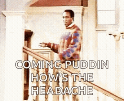 A Man In A Plaid Sweater Is Standing On A Railing . GIF