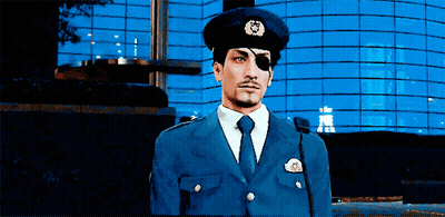 A Man In A Police Uniform Has A Patch On His Eye That Says ' A ' On It GIF