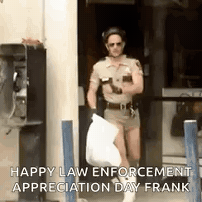 A Man In A Police Uniform Is Carrying A Trash Bag And A Cell Phone . GIF