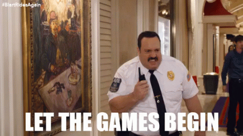 A Man In A Police Uniform Is Holding A Walkie Talkie In A Hallway . GIF