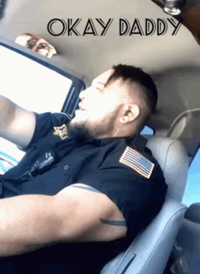 A Man In A Police Uniform Is Sleeping In The Back Seat Of A Car With The Words Okay Daddy Above Him GIF