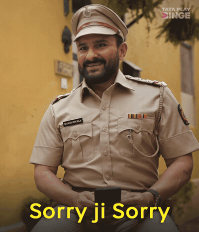 A Man In A Police Uniform Is Smiling With The Words Sorry Ji Sorry Above Him GIF
