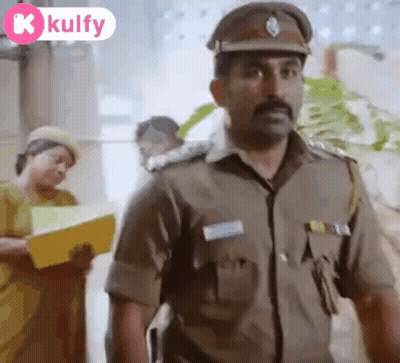 A Man In A Police Uniform Is Standing In Front Of A Woman Holding A Yellow Folder . GIF