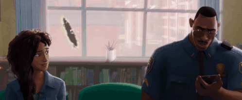 A Man In A Police Uniform Talks To A Woman In A Living Room GIF