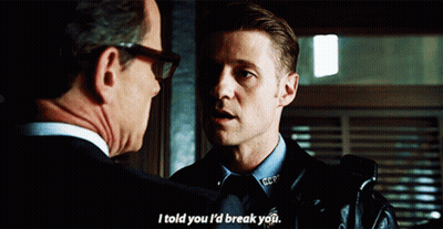 A Man In A Police Uniform Talks To Another Man In A Suit GIF