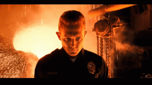 A Man In A Police Uniform With A Badge That Says ' Smith ' On It GIF