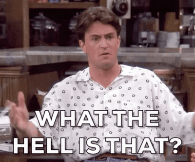 A Man In A Polka Dot Shirt Is Giving A Thumbs Up And Says What The Hell Is That ? GIF