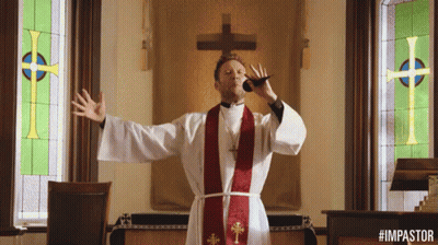 A Man In A Priest 'S Robe Is Blowing A Horn In Front Of A Cross GIF