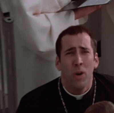 A Man In A Priest 'S Robe Is Holding A Bible In His Hand And Making A Funny Face . GIF