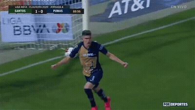 A Man In A Pumas Jersey Celebrates A Goal On A Soccer Field GIF