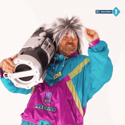 A Man In A Purple And Blue Jacket Is Holding A Boombox With Bayern 1 On The Bottom Right GIF