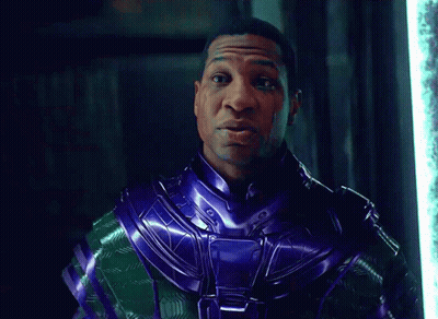 A Man In A Purple And Green Costume Says Time GIF