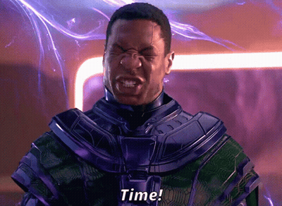 A Man In A Purple And Green Suit Is Screaming The Word Time GIF