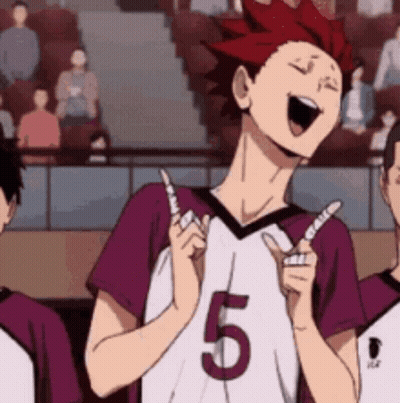 A Man In A Purple And White Jersey With The Number 5 On It Is Laughing And Giving A Thumbs Up . GIF